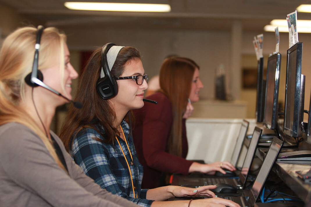 Rokrbox callers working with leads at their desks